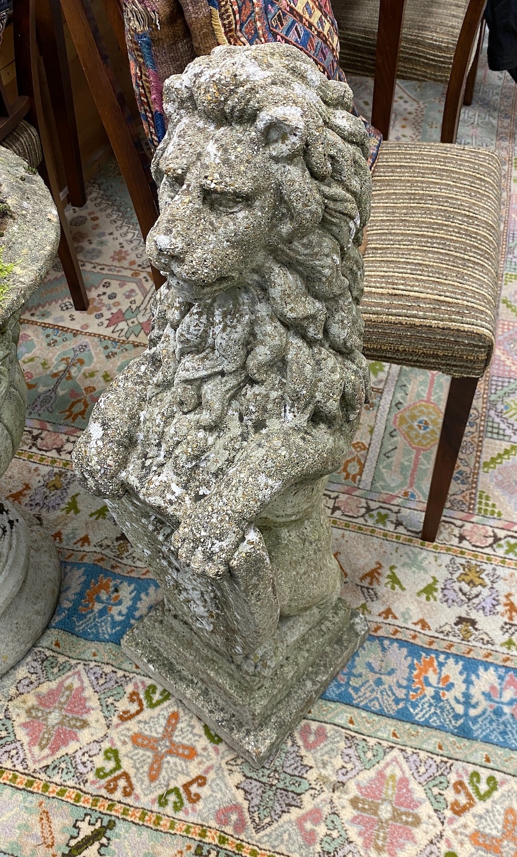 A pair of reconstituted stone heraldic lion garden ornaments, height 82cm
